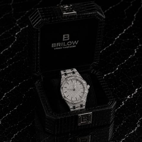 Brilow luxury diamond watch displayed in open black branded box on marble surface