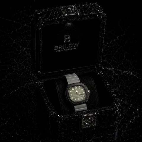Brlow watch with gray dial and steel band displayed in black branded box packaging