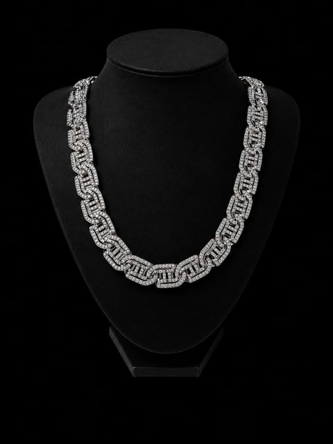Silver chain necklace with geometric links displayed on a black mannequin bust against a black background