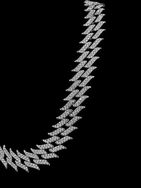 Stylized diamond checkmark or lightning bolt shape with textured pattern on black background