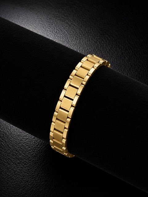 Gold-tone metal link bracelet displayed on a black cylindrical stand against dark textured background