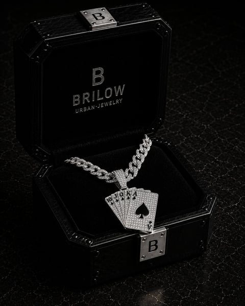 Silver playing card pendant with diamond chain displayed in an open Brilow Urban Jewelry black box