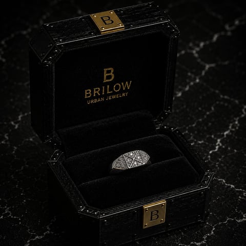 Black Brilow Urban Jewelry box with gold accents displaying a geometric patterned silver ring on dark marble surface