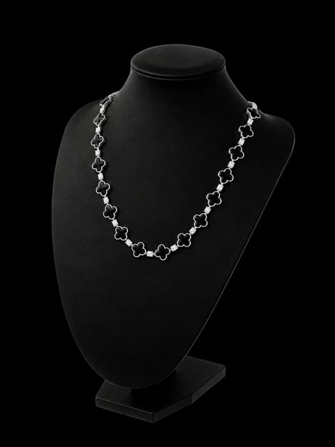 Silver link chain necklace displayed on a black mannequin bust against a dark background