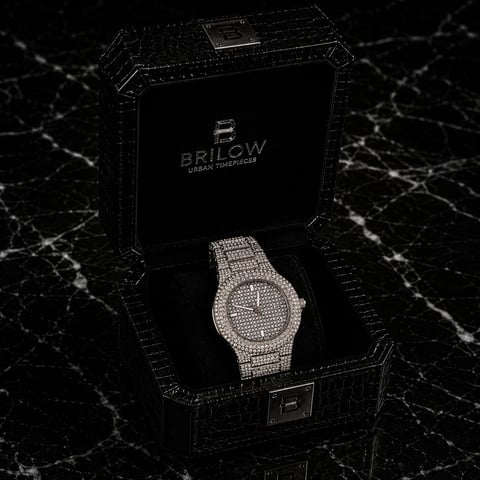 Luxury diamond-encrusted Brilow watch displayed in black branded box on marble surface